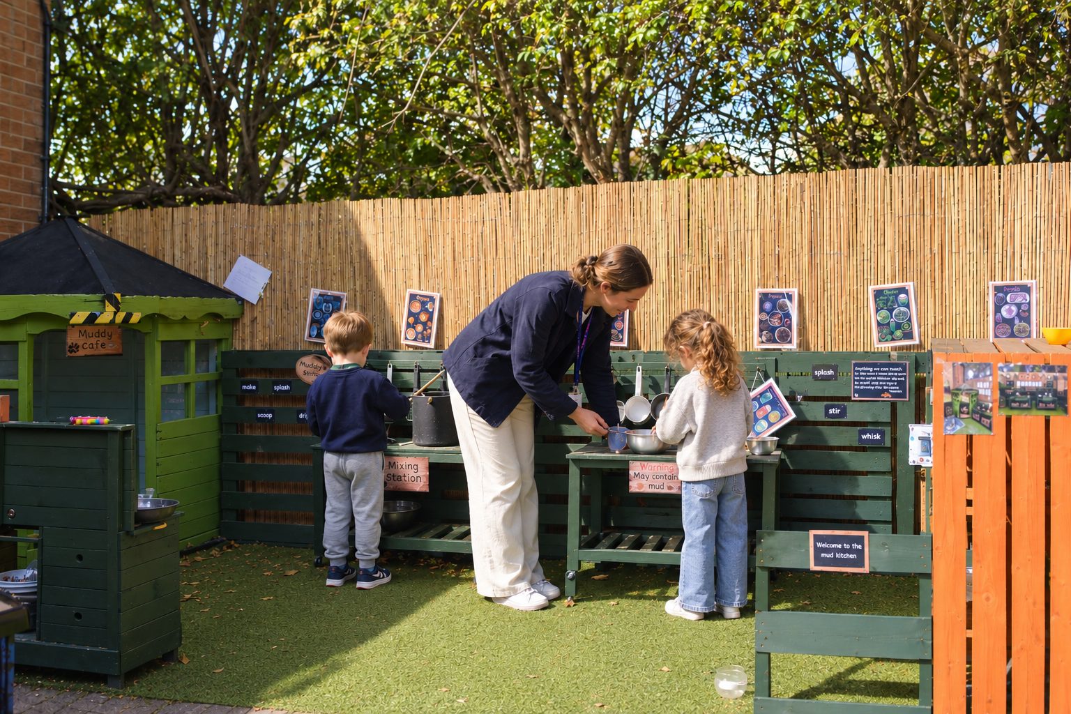 Children playing in the outdoor mud kitchen